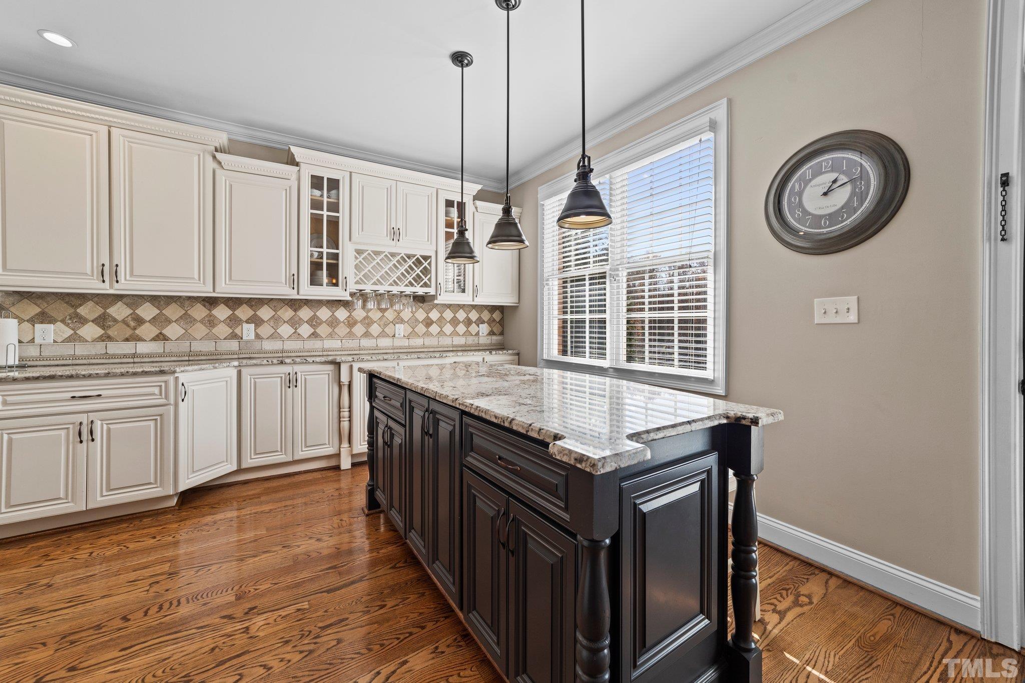 213 Serendipity Drive Haw River, NC 27258 - Photo 21 of 33 a kitchen with a stove window a clock and cabinets