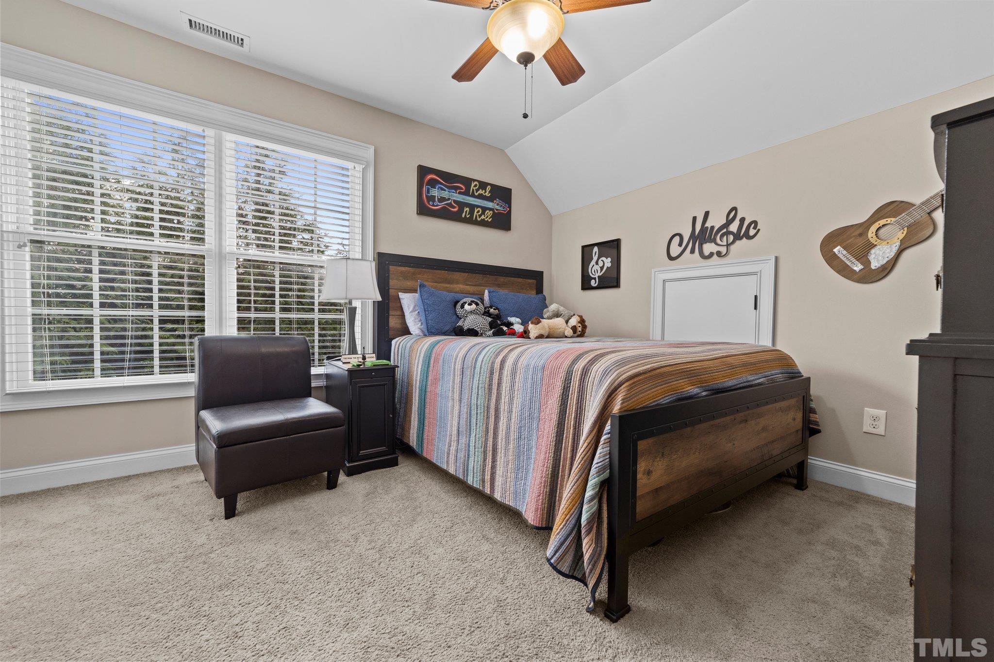 213 Serendipity Drive Haw River, NC 27258 - Photo 27 of 33 a bedroom with a bed and a couch