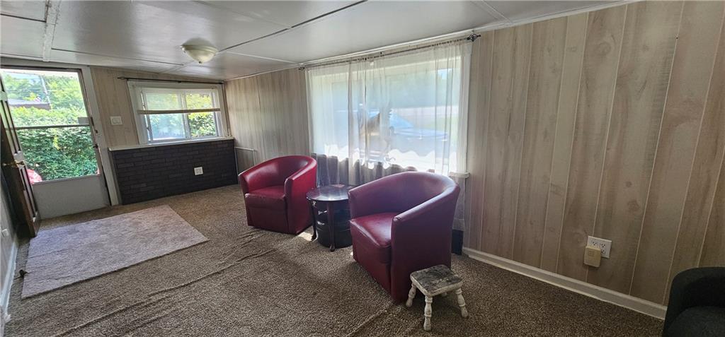 3403 Ellwood Road New Castle, PA 16101 - Photo 3 of 21 a living room with furniture a window and a shower