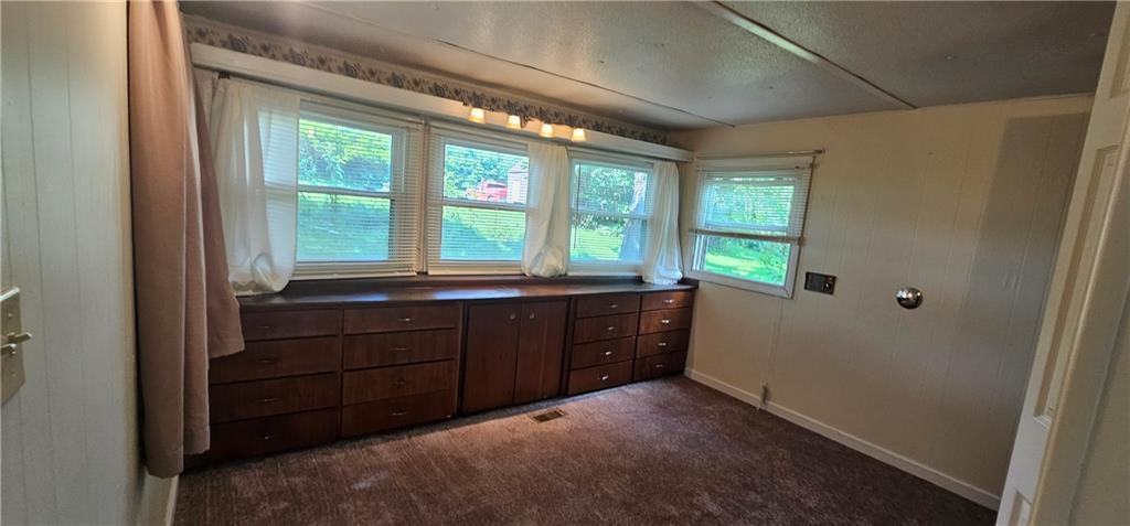 3403 Ellwood Road New Castle, PA 16101 - Photo 8 of 21 a room with a large window and a bed