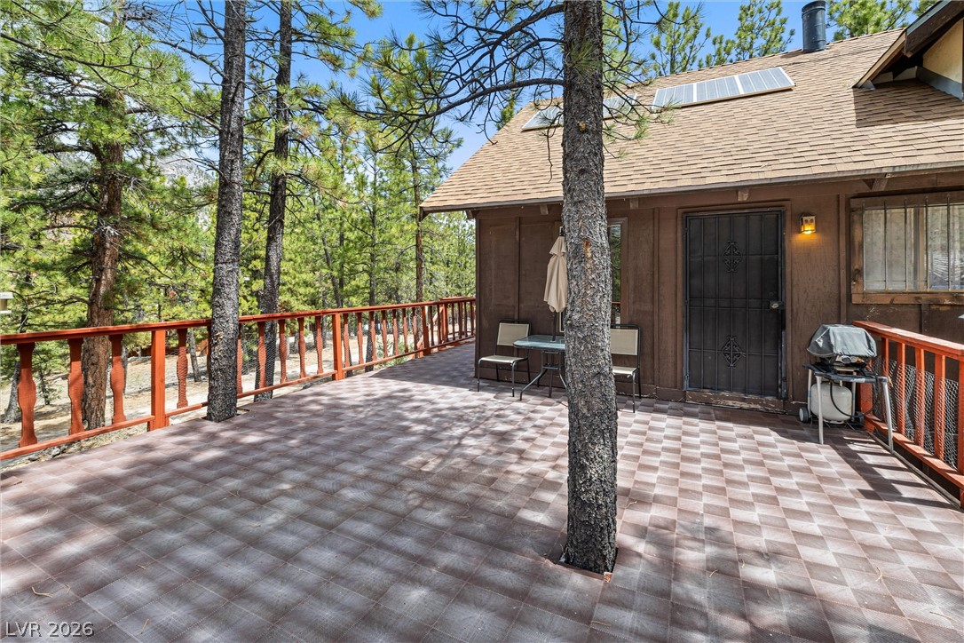 2146 Via Spes Nostra Street Mount Charleston, NV 89124 - Photo 8 of 33 An inviting deck offers vast forest views, perfect for peaceful outdoor living.