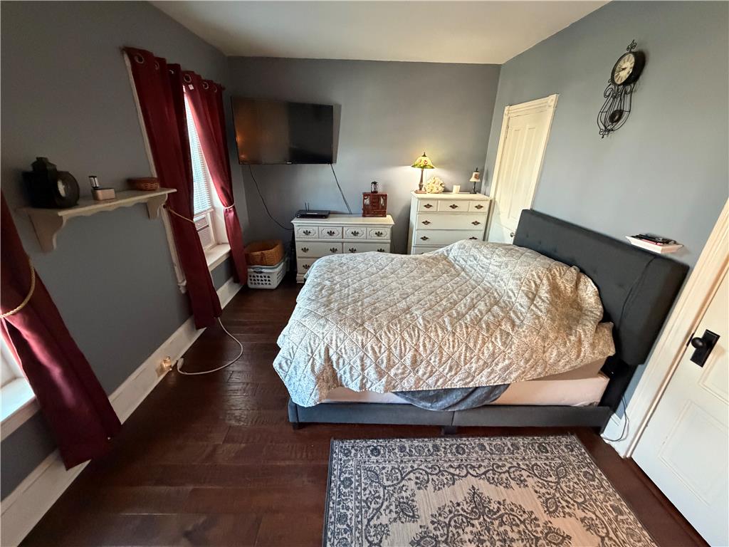 27 South Chestnut Street Boyertown, PA 19512 - Photo 16 of 17 Rich hardwood floors complement this cozy bedroom with natural light and inviting ambiance.