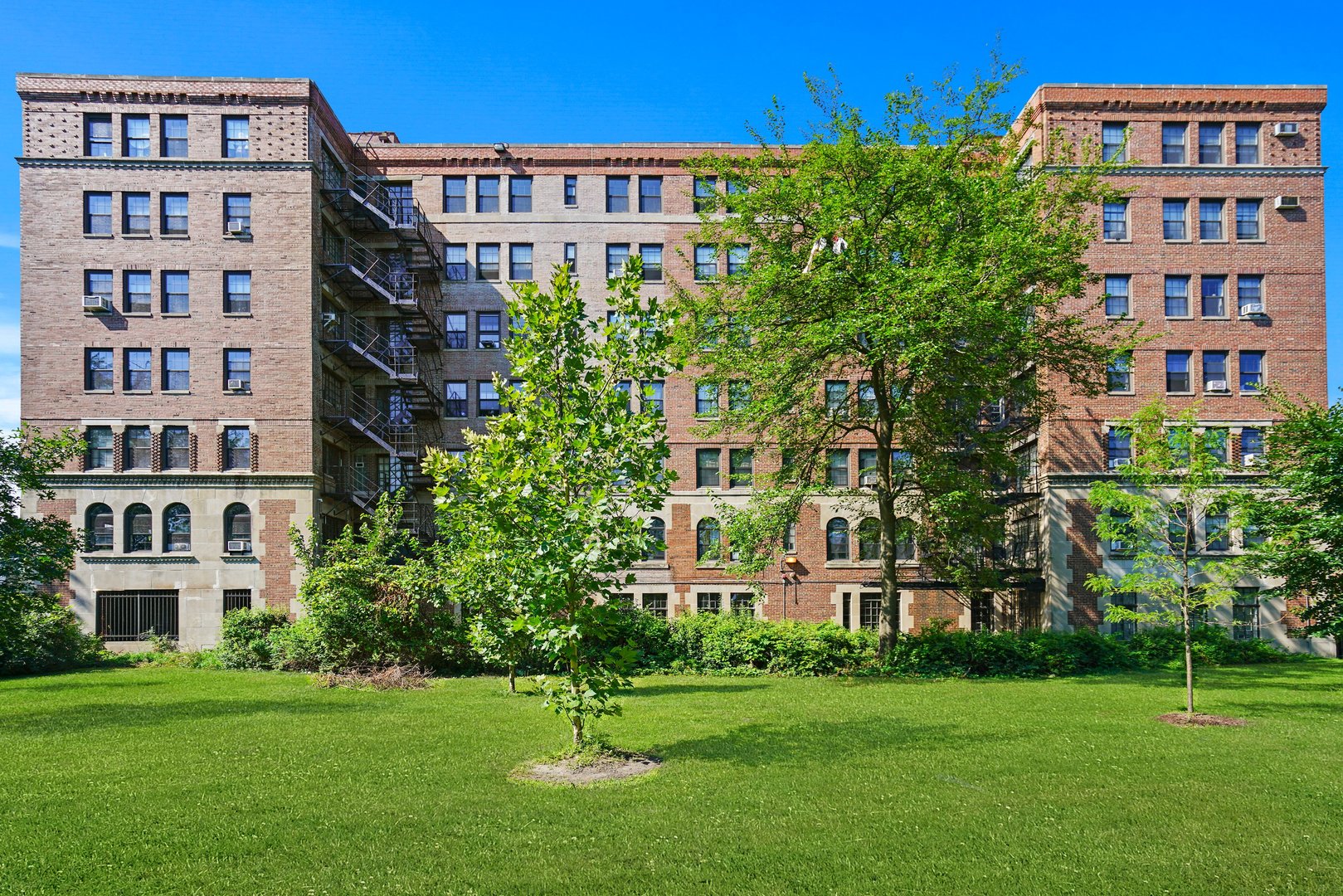 3017 East 78th Street, Unit 2B Chicago, IL 60649 - Photo 1 of 20 a view of a building with a yard