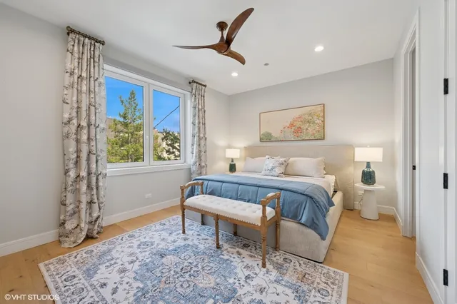 a spacious bedroom with a bed and a window