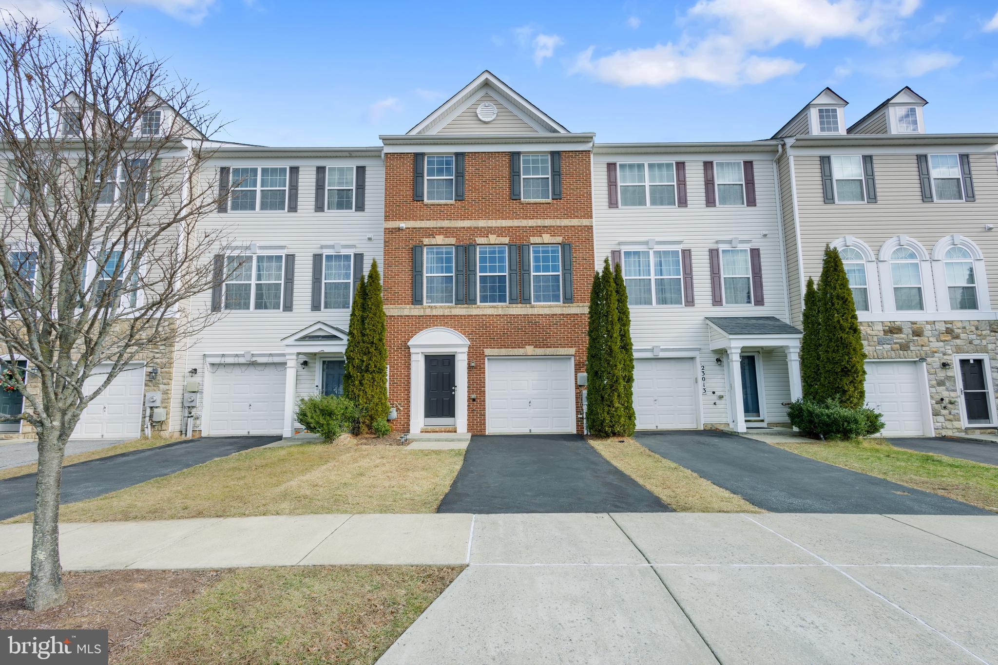 23015 Heath Aster Way Clarksburg, MD 20871 - Photo 1 of 21 a front view of a house with a yard