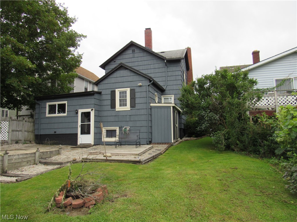 1713 West Prospect Road Ashtabula, OH 44004 - Photo 26 of 27 Rear view of house featuring a lawn