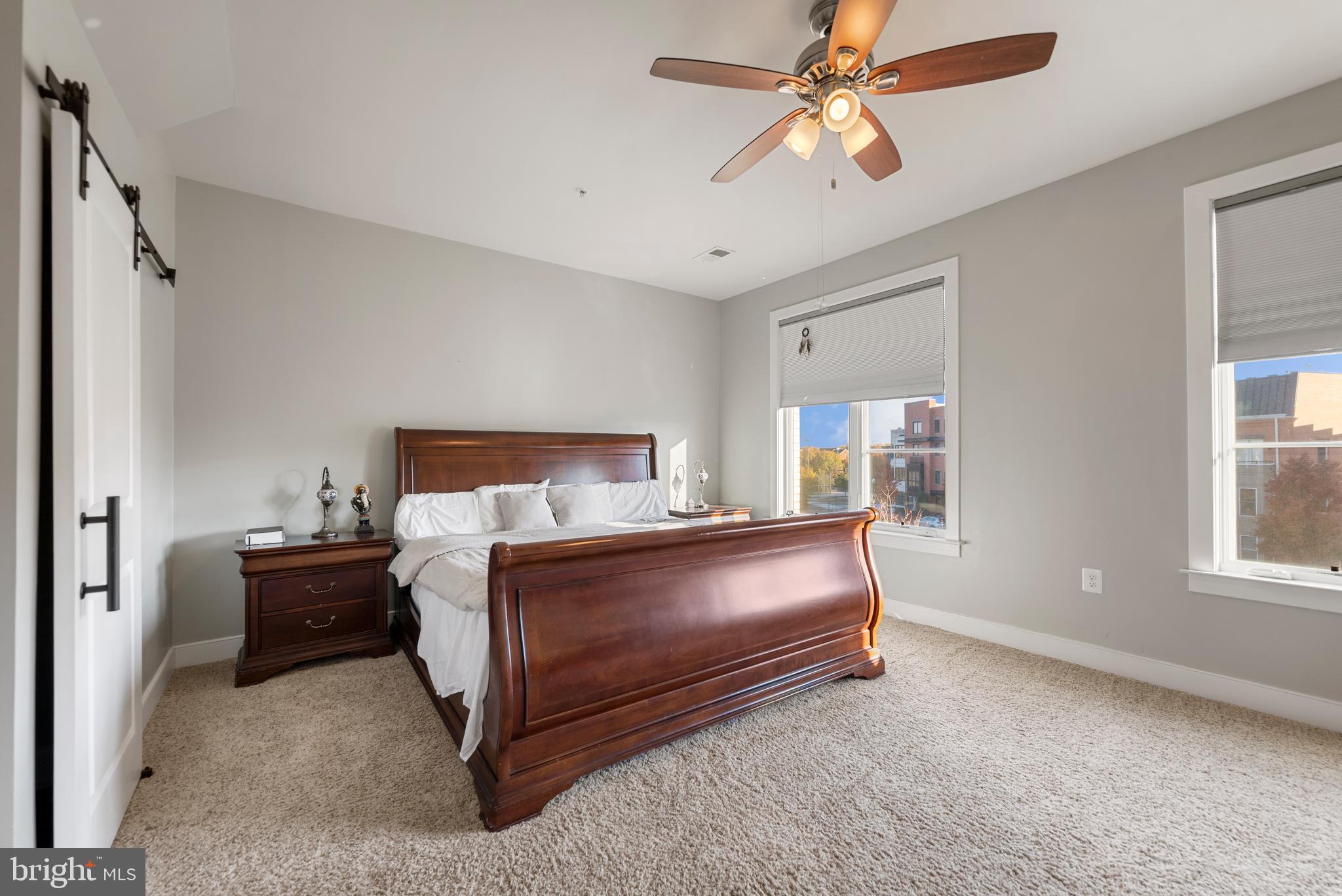 710 East Howell Avenue Alexandria, VA 22301 - Photo 14 of 43 a bed room with a bed and a chandelier