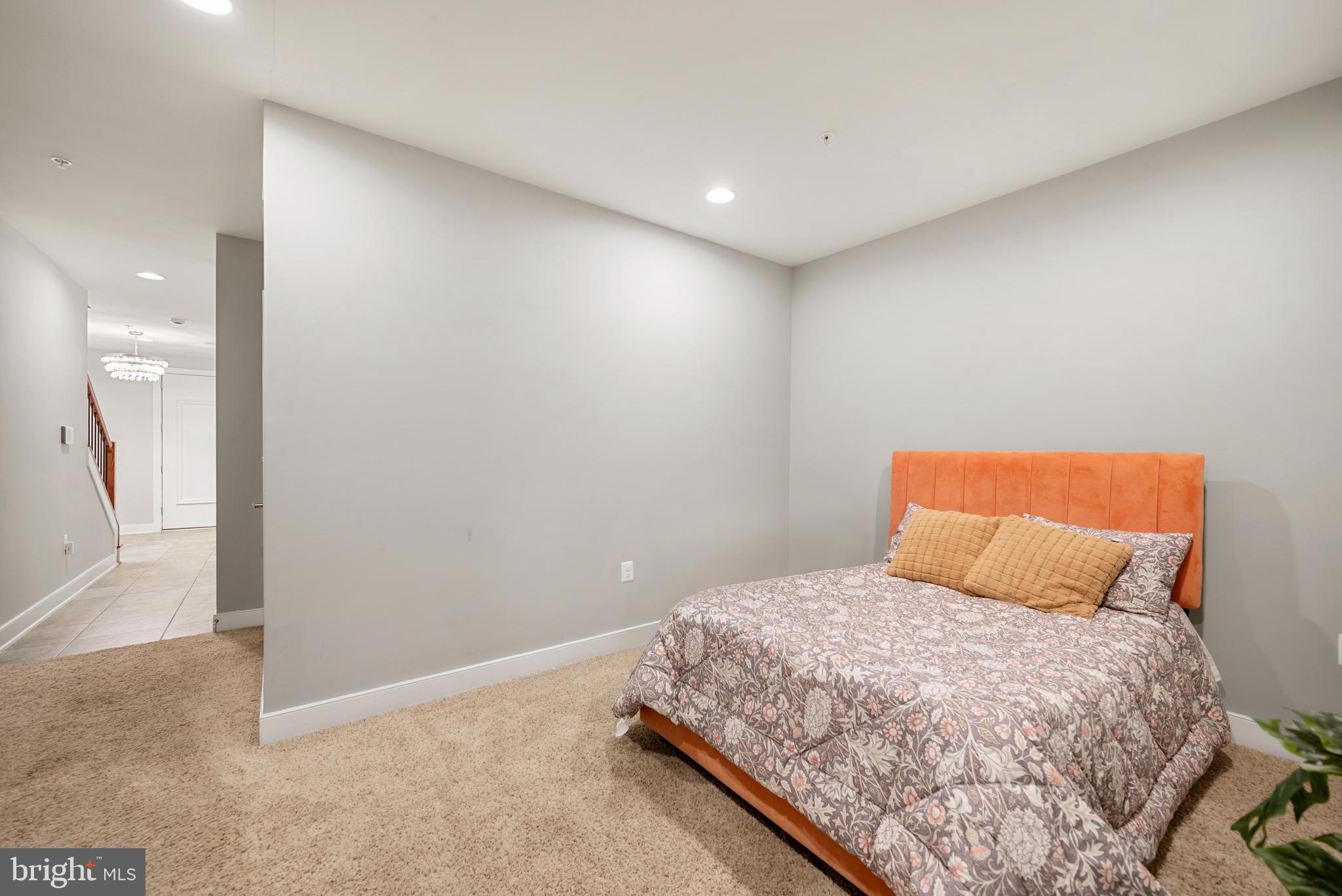 710 East Howell Avenue Alexandria, VA 22301 - Photo 32 of 43 a bedroom with a bed and a large mirror