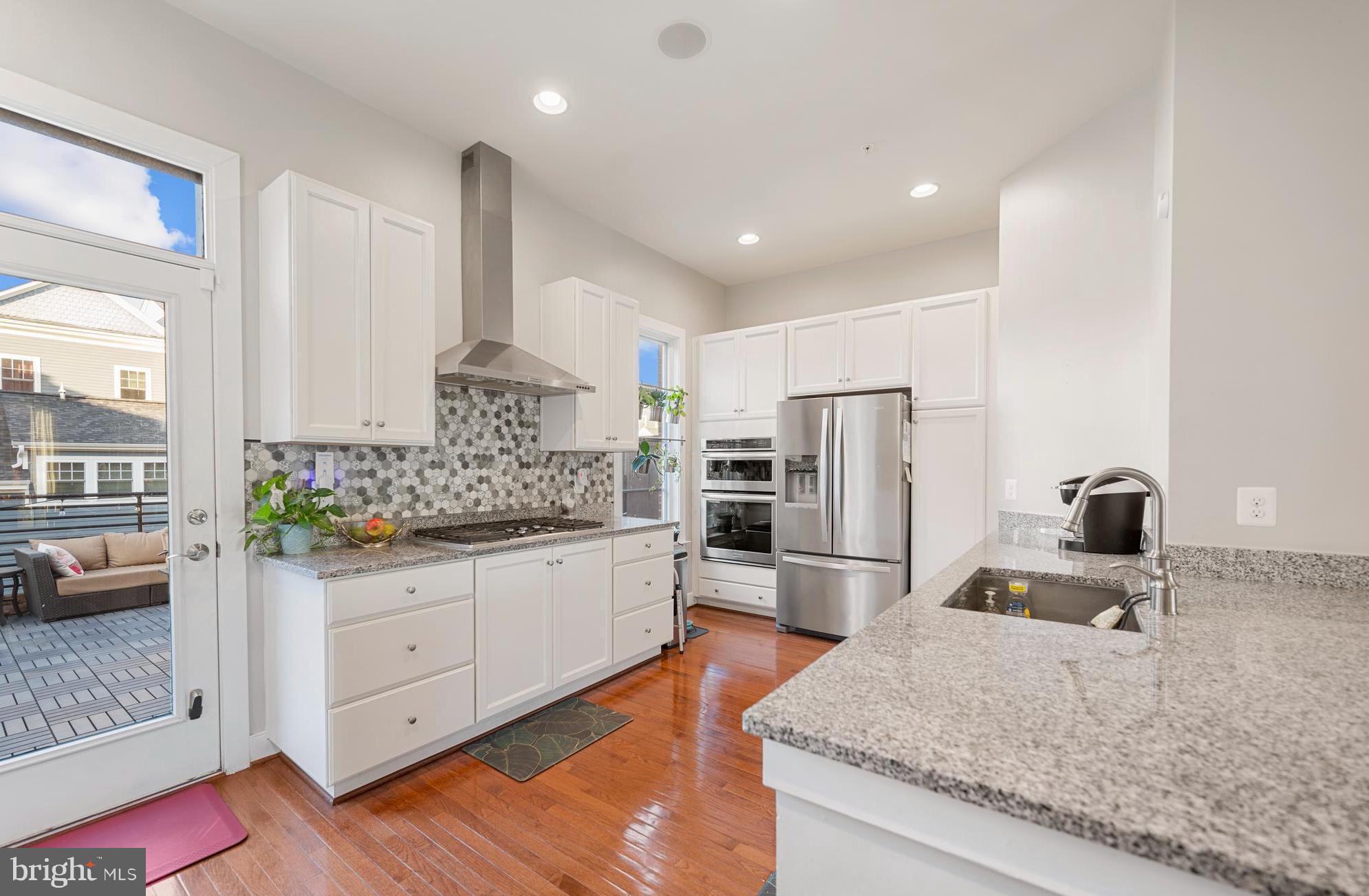 710 East Howell Avenue Alexandria, VA 22301 - Photo 4 of 43 a kitchen with stainless steel appliances granite countertop a sink stove and refrigerator