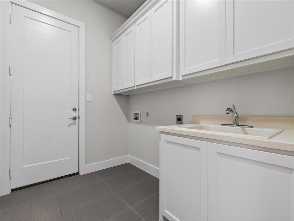 4003 Marble Hill Road Frisco, TX 75034 - Photo 25 of 40 a utility room with a sink