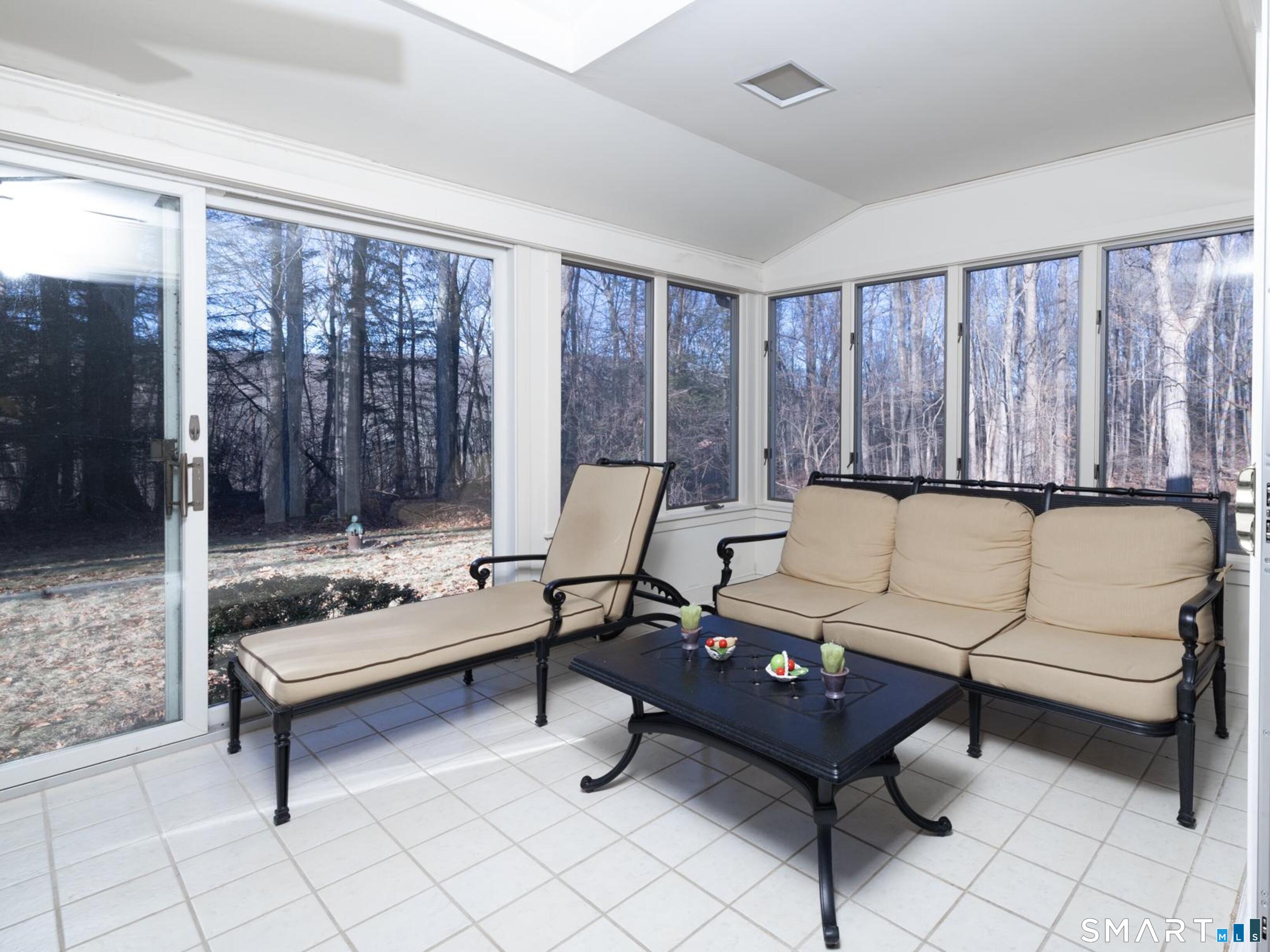 117 Crest Road Middlebury, CT 06762 - Photo 19 of 38 Most charming room in the house. This heated sunroom is the full width of the living room and can be used year round if you so choose. It overlooks the level back yard area and into the woods toward the Crest Rd. Preserve.