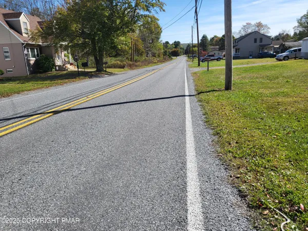 a view of a park with basketball court