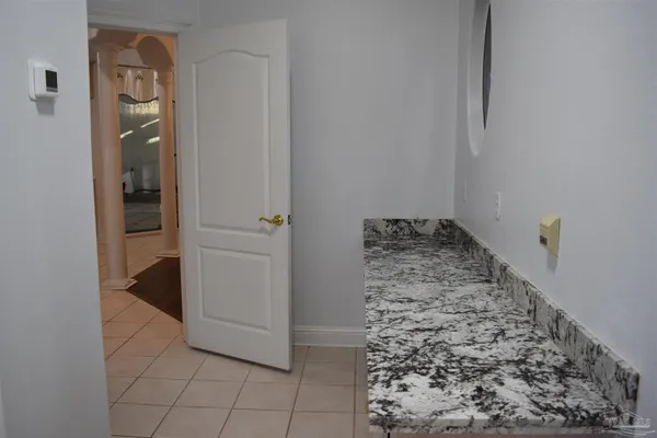 a white toilet sitting next to a bathroom sink and a shower