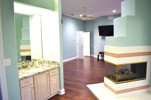 a bath tub sitting in a bathroom next to a window