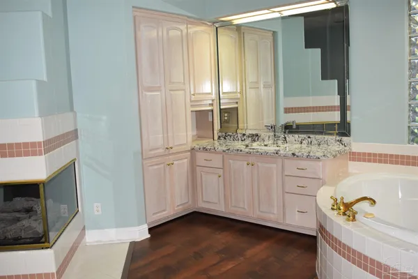 a view of a bathroom with a glass door and a shower