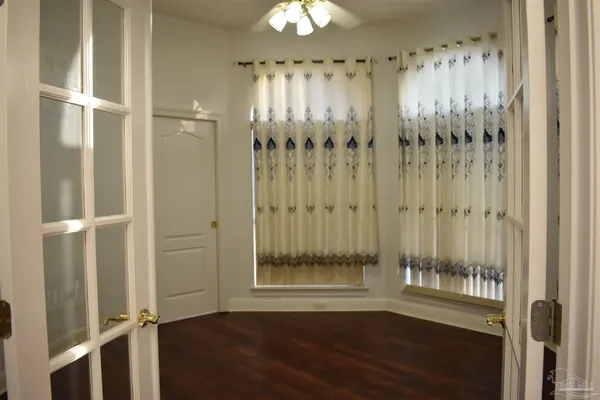 a very nice looking room with wooden floor