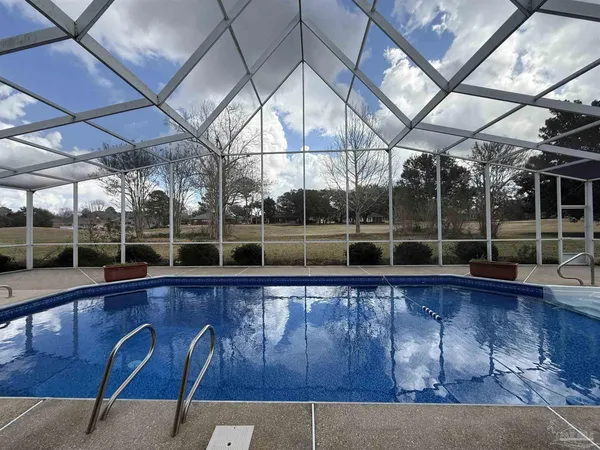 a view of a swimming pool with a porch