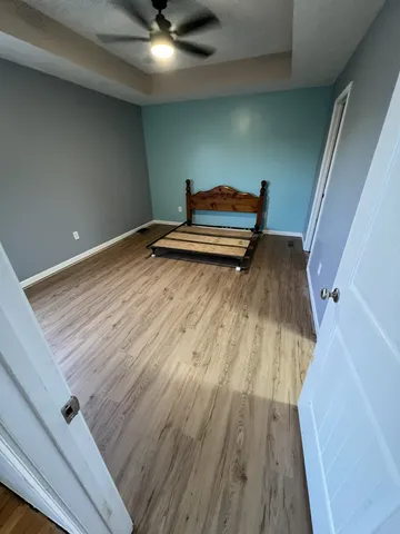 a view of wooden floor in an empty room
