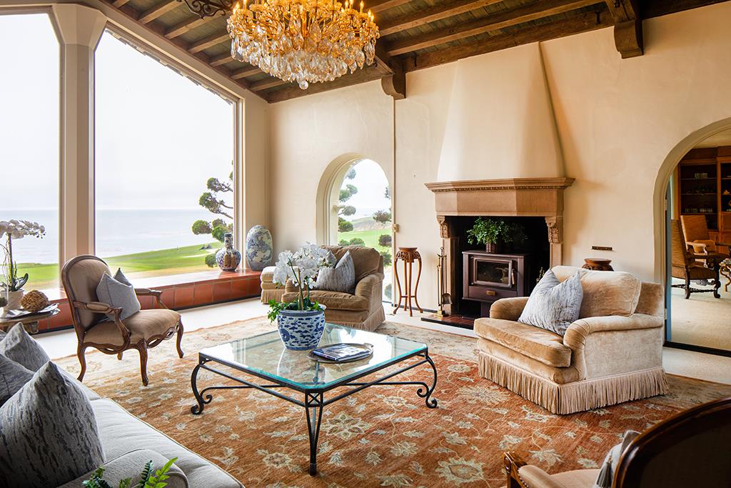 3406 17 Mile Drive Pebble Beach, CA 93953 - Photo 5 of 11 a living room with furniture a fireplace and a large window