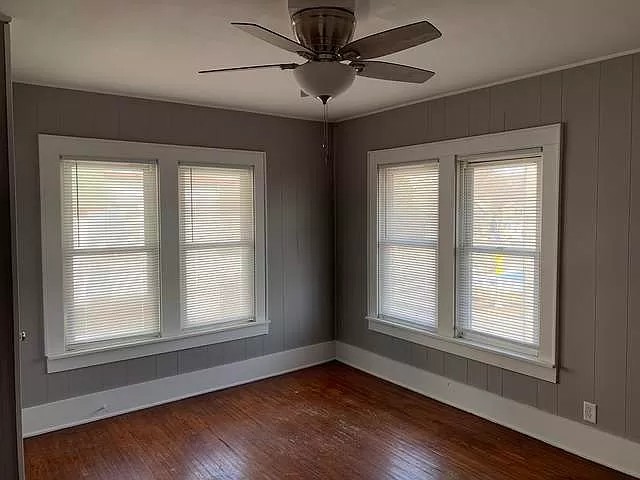 325 North 7th Street DeKalb, IL 60115 - Photo 15 of 20 a view of an empty room with wooden floor and a window