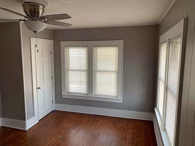 325 North 7th Street DeKalb, IL 60115 - Photo 17 of 20 a view of an empty room with wooden floor and a window