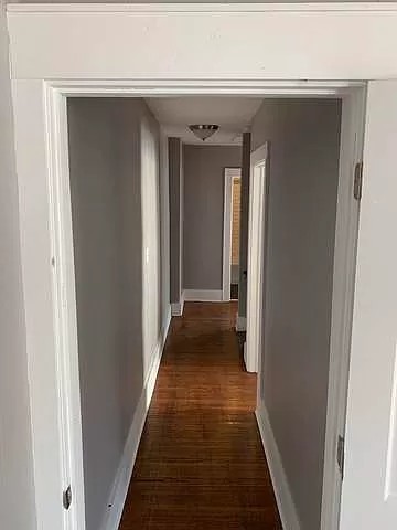 325 North 7th Street DeKalb, IL 60115 - Photo 18 of 20 a view of a hallway with a wooden door
