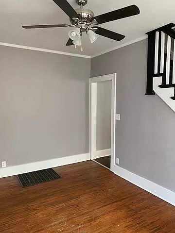 325 North 7th Street DeKalb, IL 60115 - Photo 7 of 20 an empty room with wooden floor closet and windows