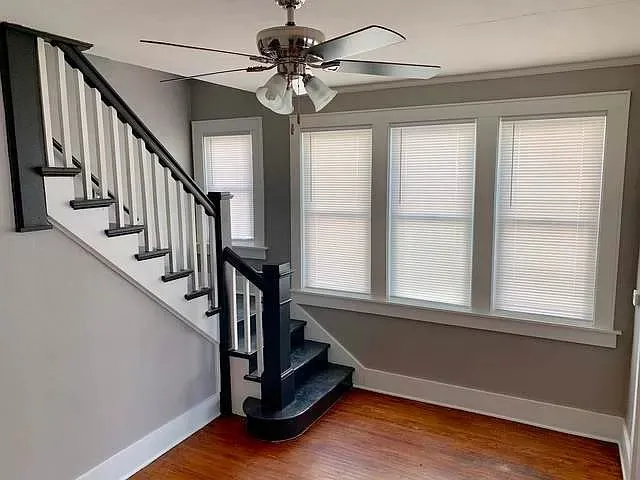 a view of an entryway with wooden floor and a window
