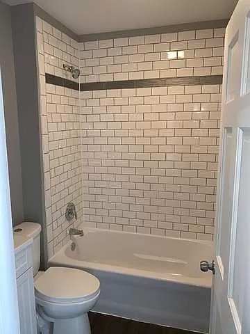 325 North 7th Street DeKalb, IL 60115 - Photo 9 of 20 a bathroom with a shower and a toilet