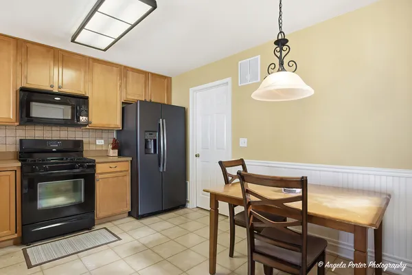 a kitchen with a sink stove and refrigerator