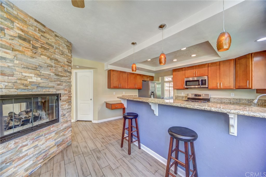 30219 Corte Cantera Temecula, CA 92591 - Photo 11 of 33 a kitchen with stainless steel appliances granite countertop a sink and cabinets
