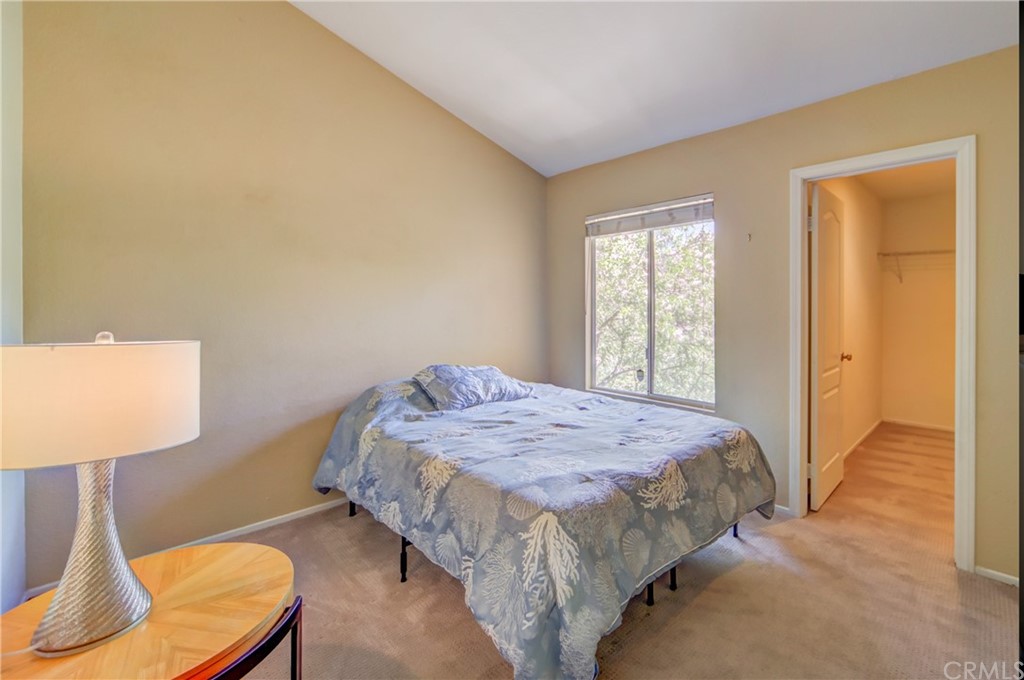 30219 Corte Cantera Temecula, CA 92591 - Photo 18 of 33 a bedroom with a bed and a lamp