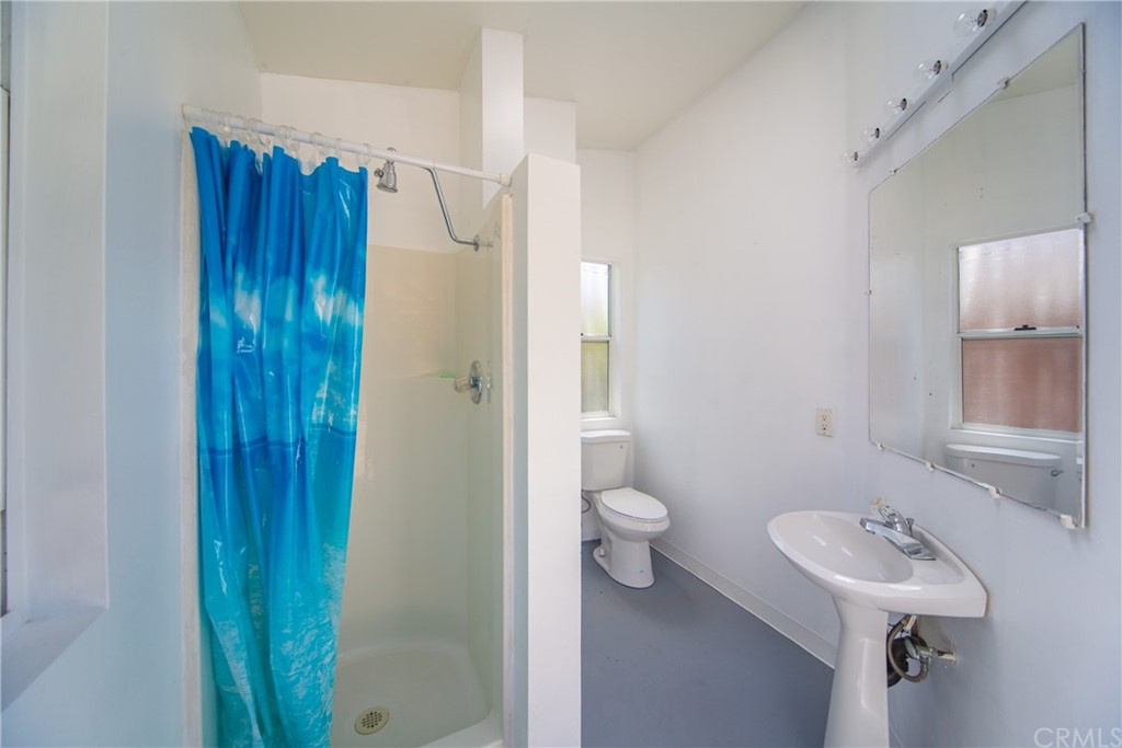30219 Corte Cantera Temecula, CA 92591 - Photo 28 of 33 a bathroom with a sink a toilet and shower