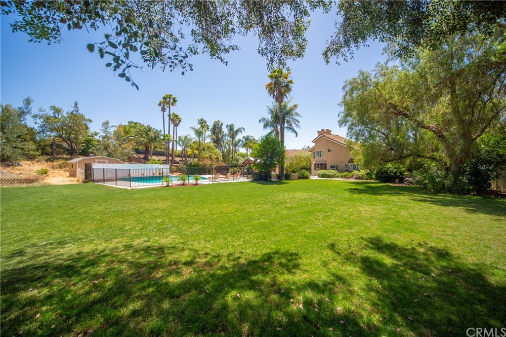 30219 Corte Cantera Temecula, CA 92591 - Photo 31 of 33 a view of yard with swimming pool and green space