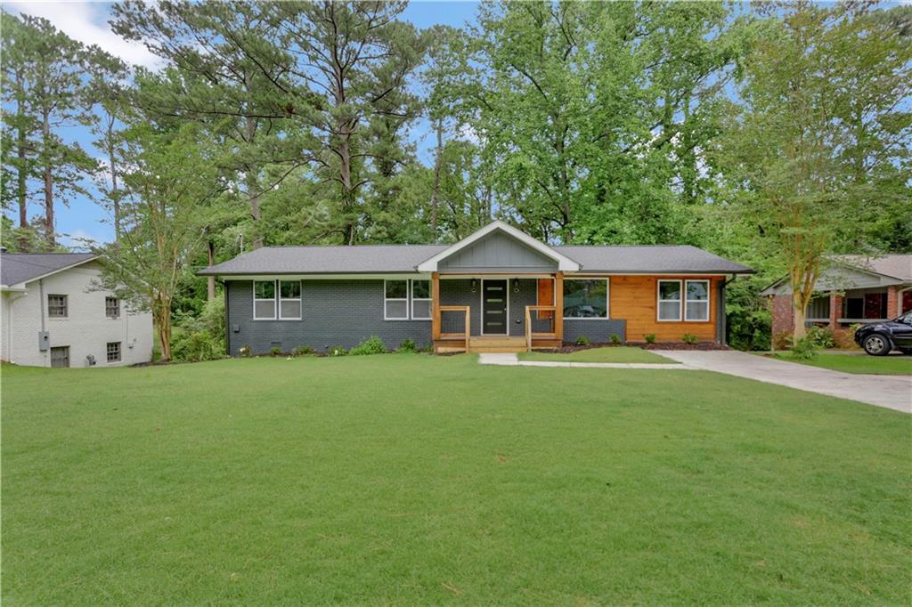2515 Ben Hill Road East Point, GA 30344 - Photo 1 of 1 a front view of a house with a garden