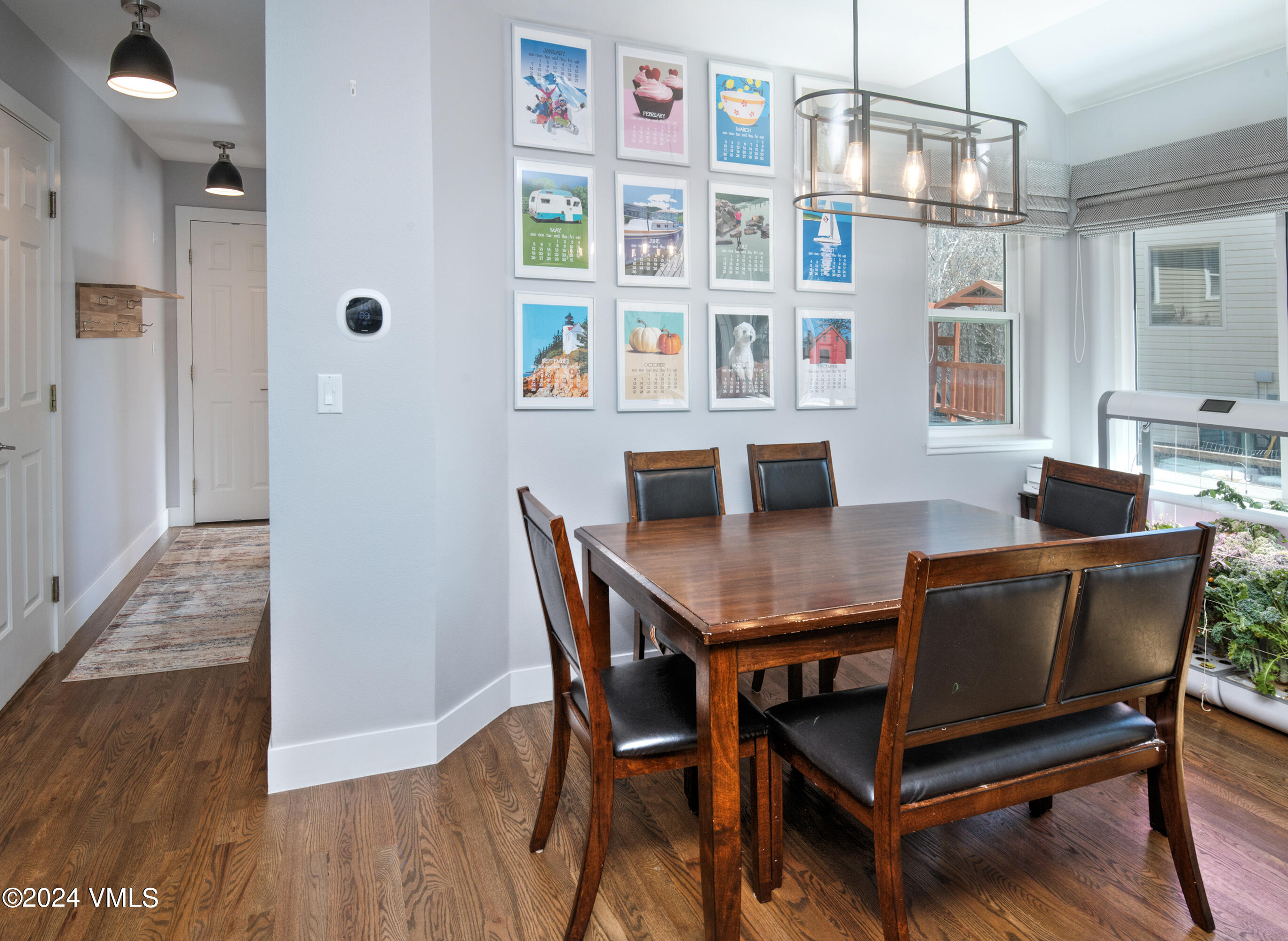 206 Golden Eagle Eagle, CO 81631 - Photo 18 of 47 a dining room with furniture and wooden floor