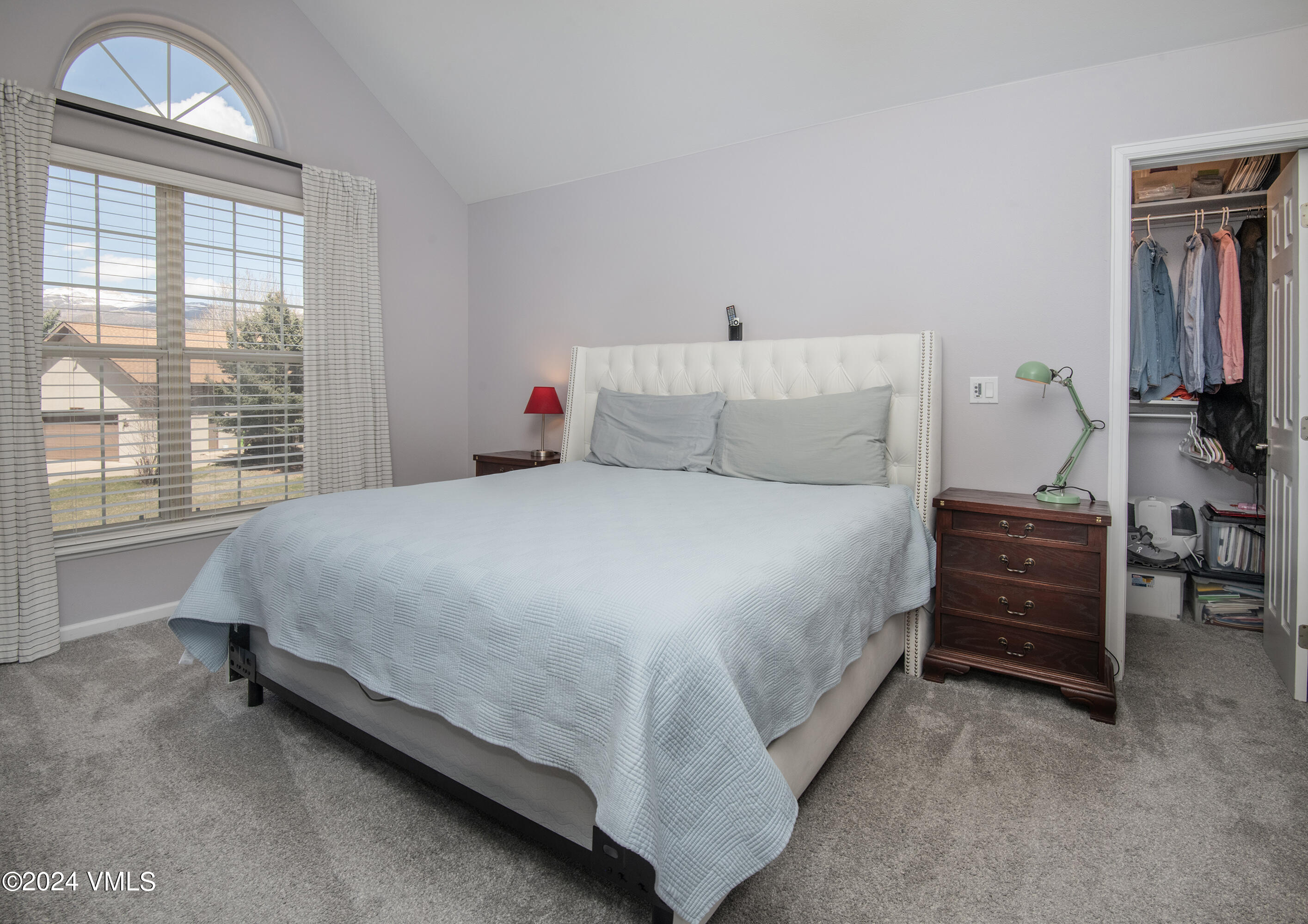 206 Golden Eagle Eagle, CO 81631 - Photo 23 of 47 a large bed sitting in a room next to a window