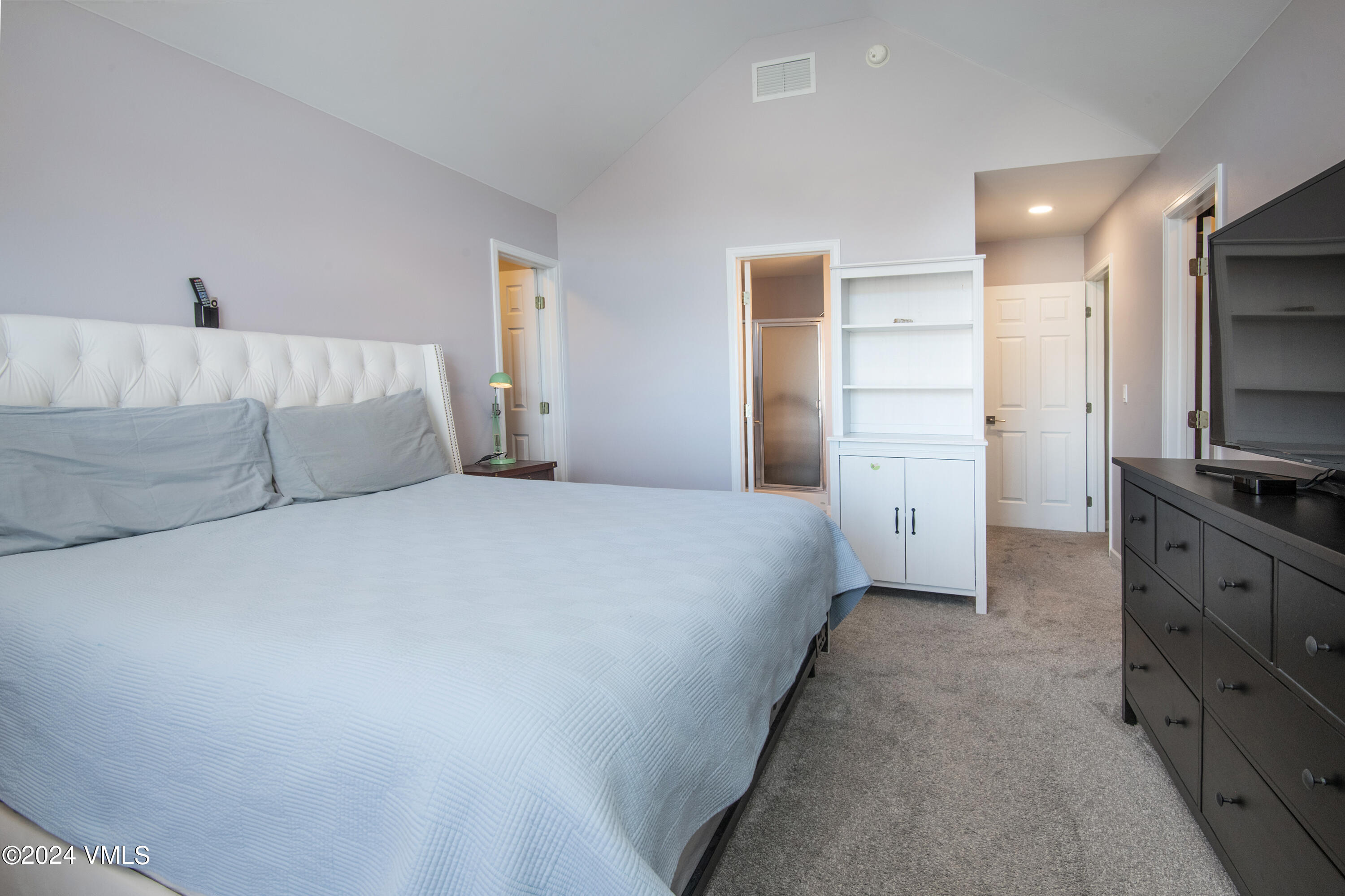 206 Golden Eagle Eagle, CO 81631 - Photo 24 of 47 a bedroom with a bed and flat screen tv