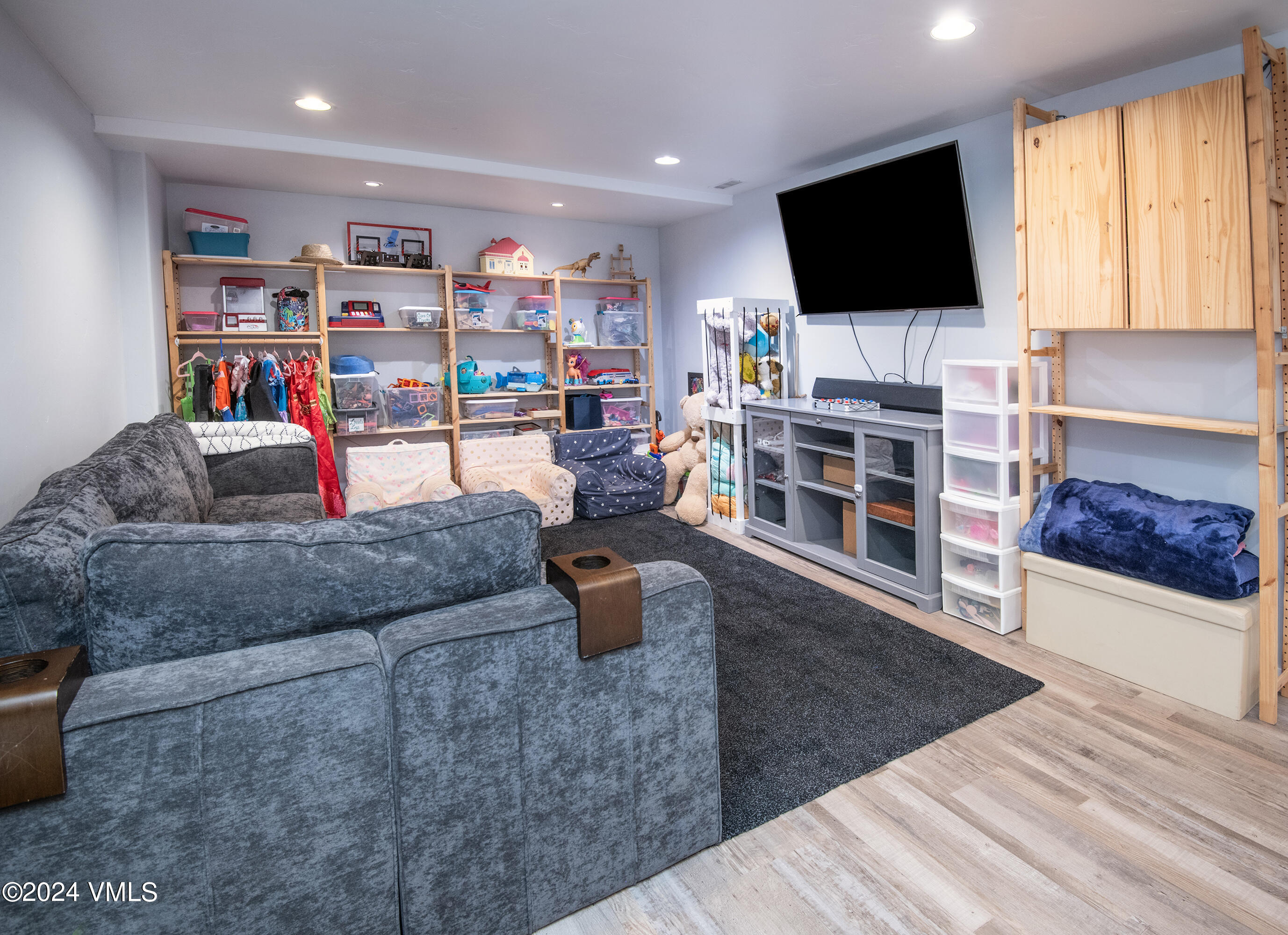206 Golden Eagle Eagle, CO 81631 - Photo 30 of 47 a living room with furniture and a flat screen tv