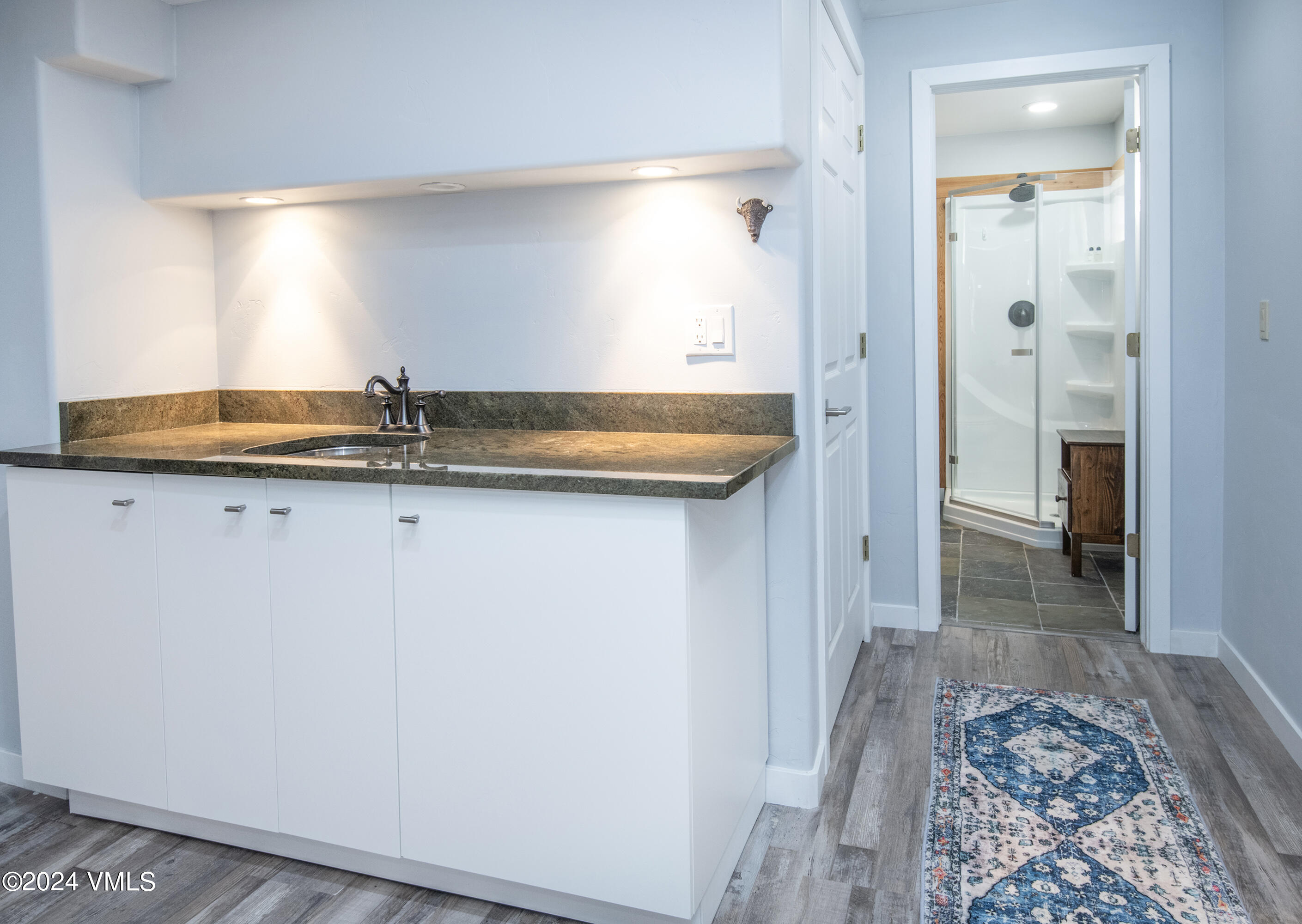 206 Golden Eagle Eagle, CO 81631 - Photo 32 of 47 a view of a bathroom with a sink and a mirror