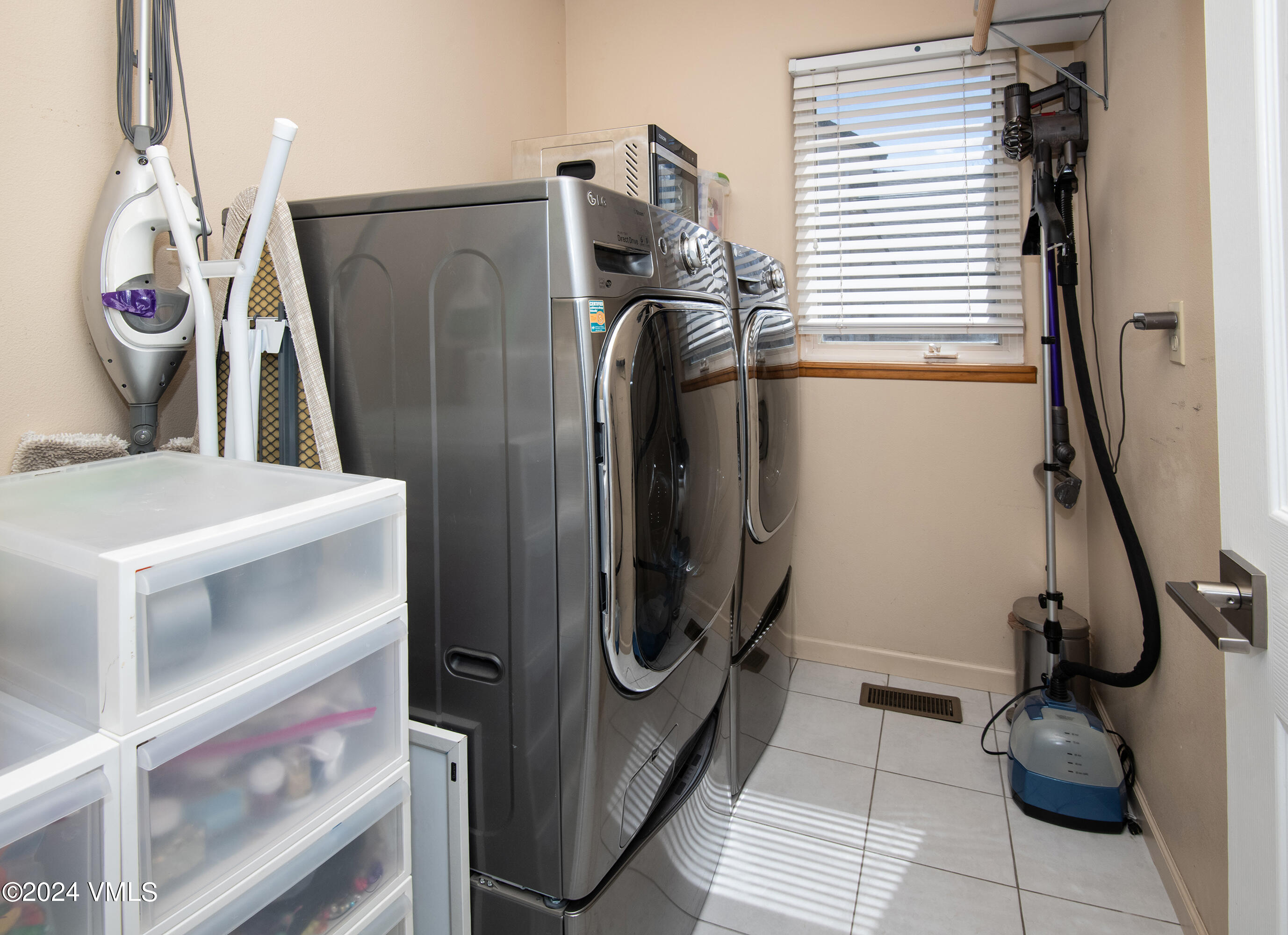 206 Golden Eagle Eagle, CO 81631 - Photo 37 of 47 a bathroom with a washing machine and storage