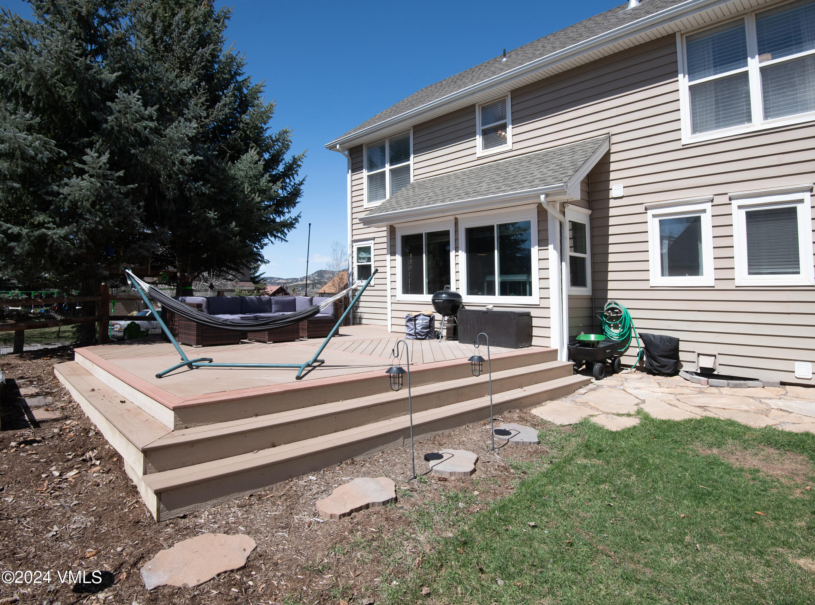 206 Golden Eagle Eagle, CO 81631 - Photo 41 of 47 a view of a white house with a chairs in patio