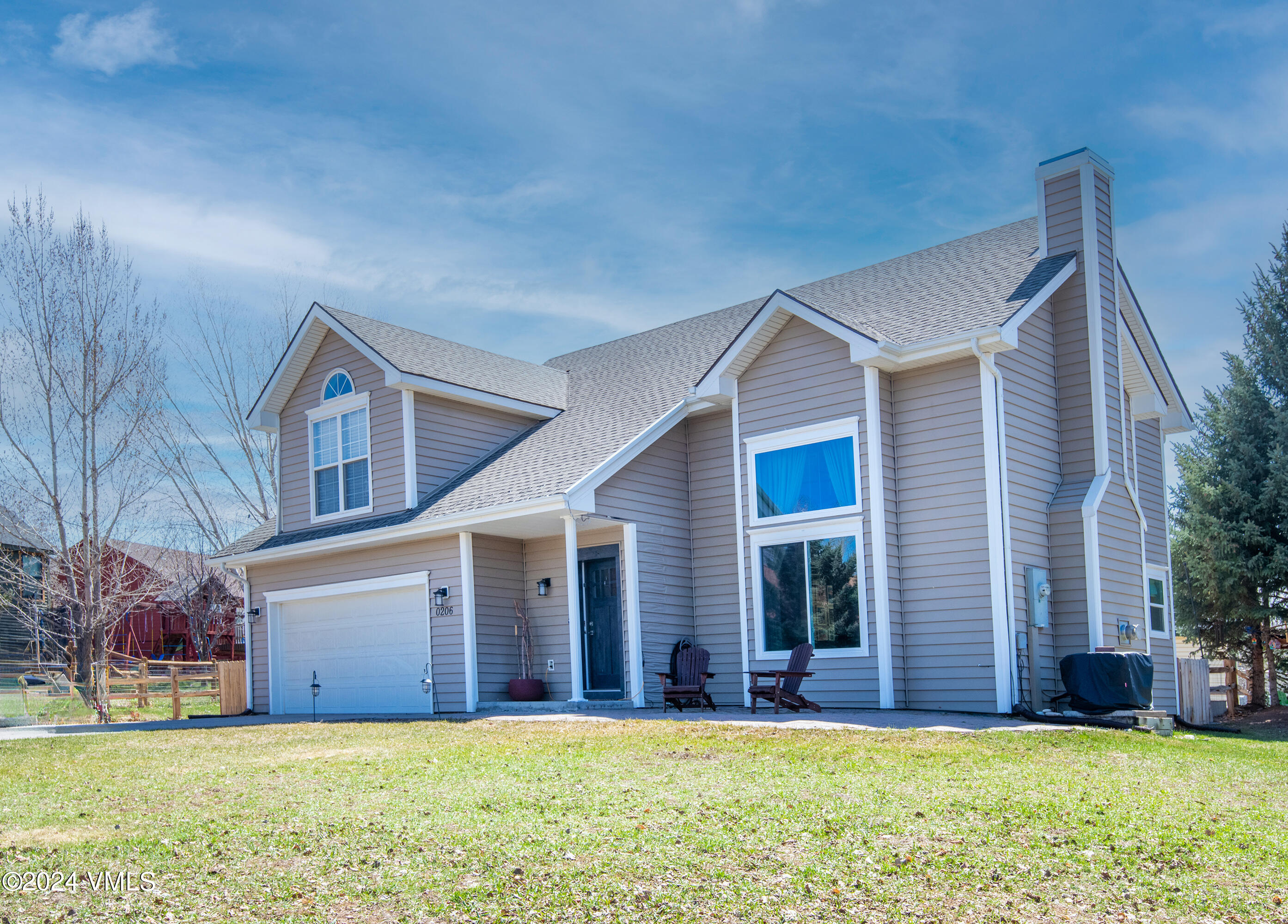 206 Golden Eagle Eagle, CO 81631 - Photo 43 of 47 a view of a house with a yard and large tree