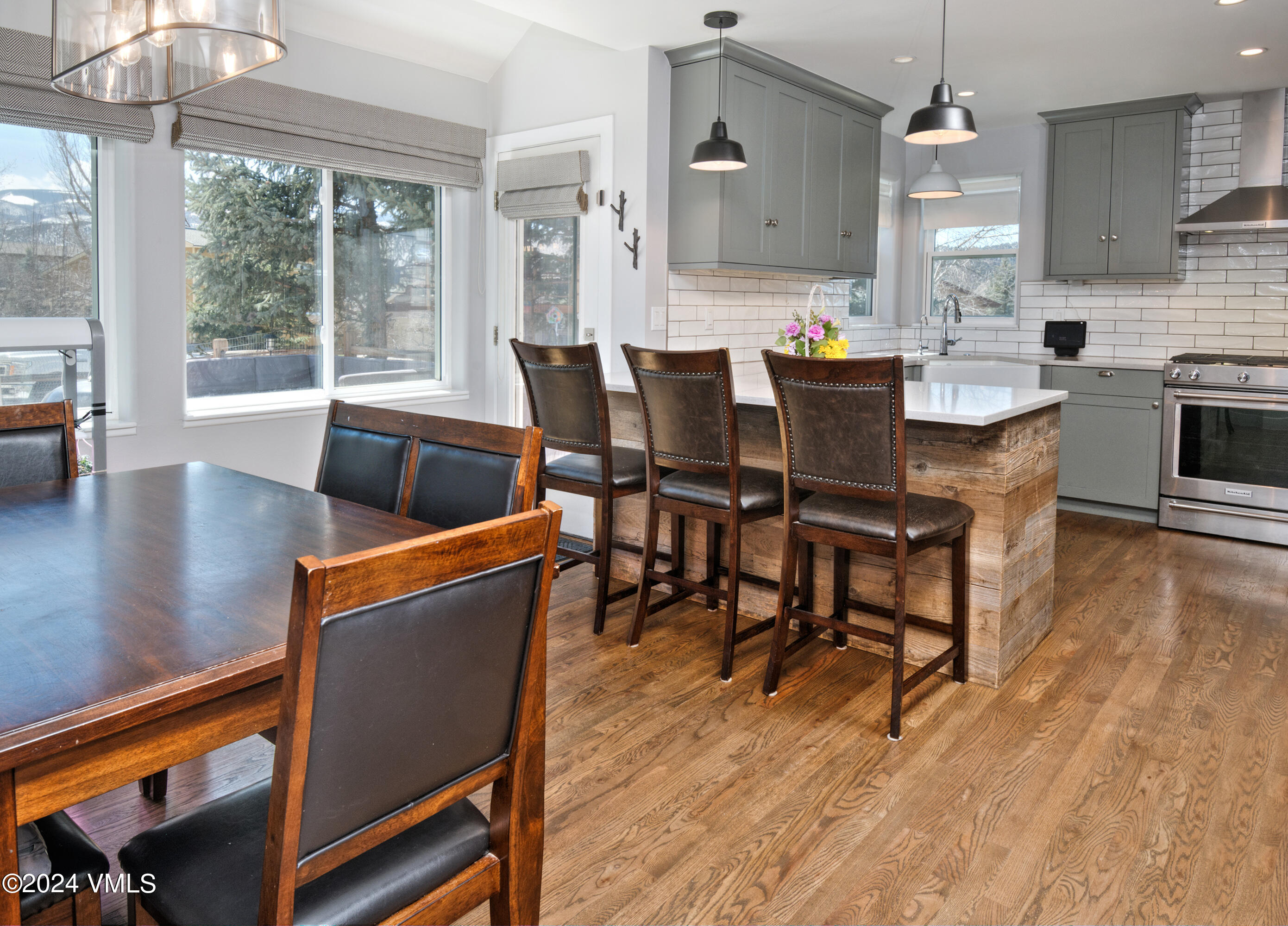 206 Golden Eagle Eagle, CO 81631 - Photo 8 of 47 a view of a dining room with furniture and wooden floor