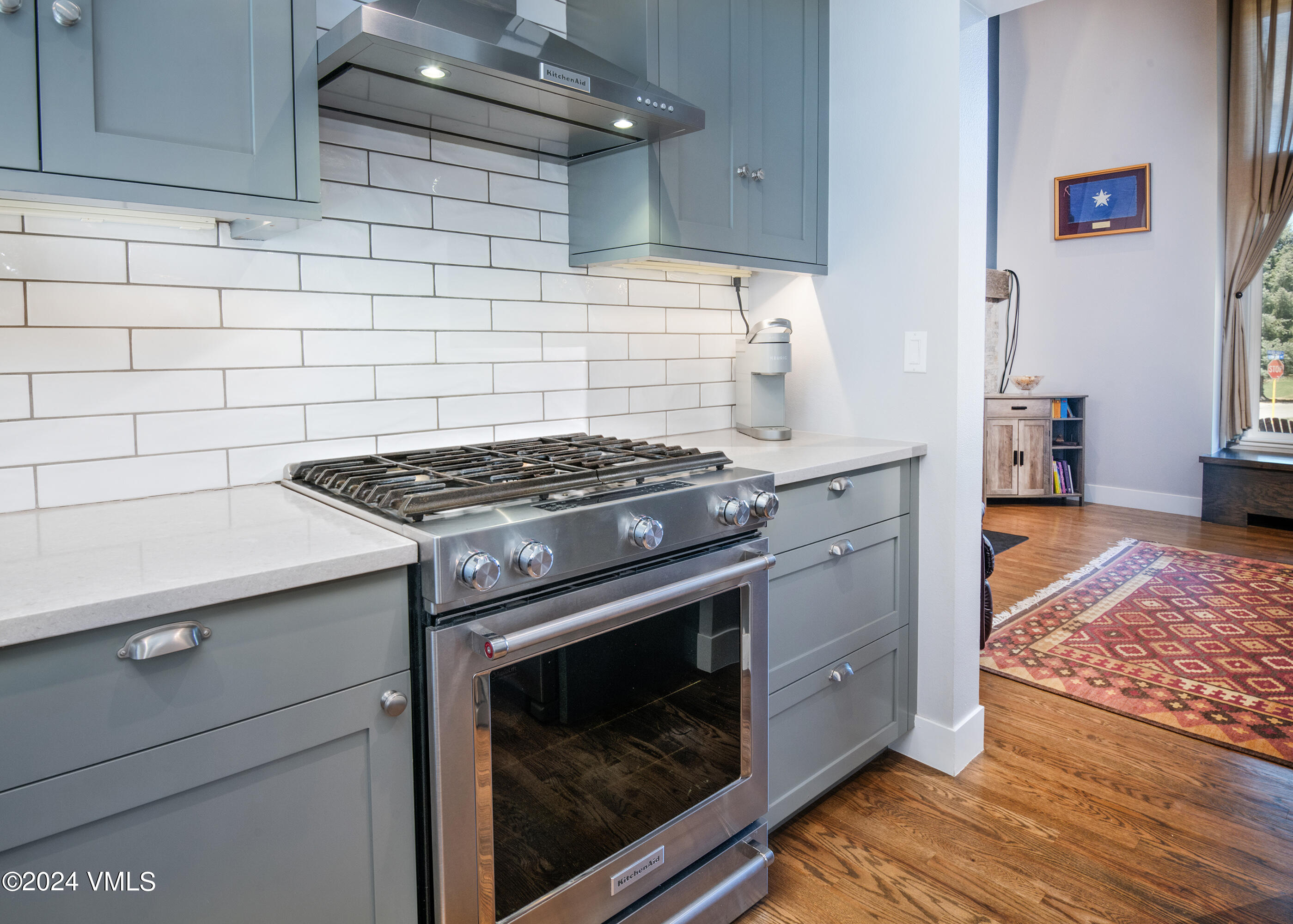 206 Golden Eagle Eagle, CO 81631 - Photo 9 of 47 a kitchen with granite countertop a stove and a sink