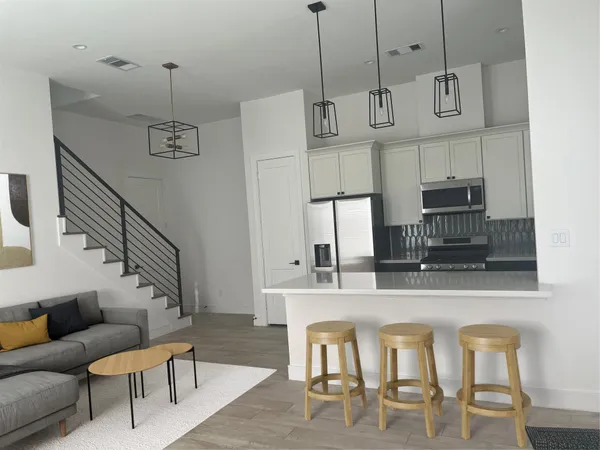 a view of kitchen with furniture and window