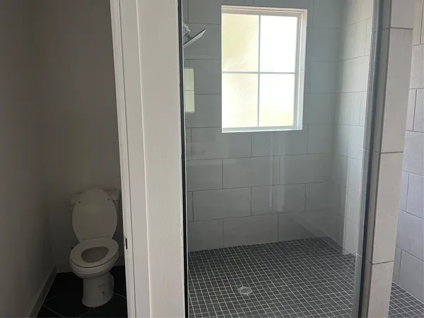 a bathroom that has a window in it
