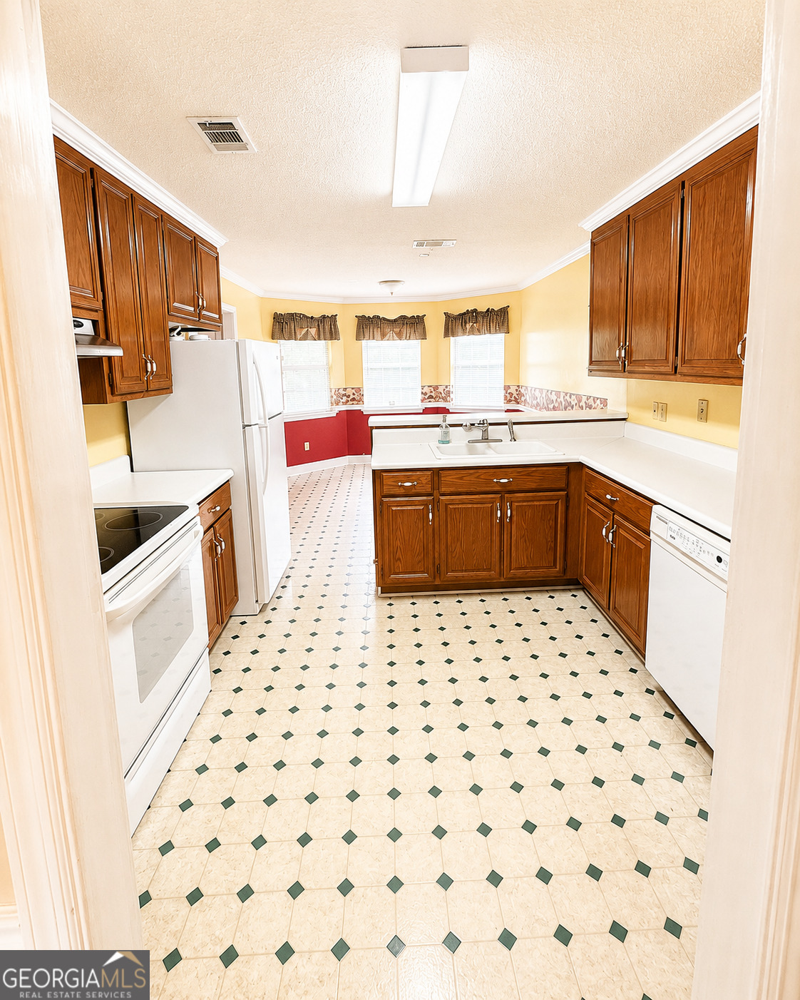 959 Lovers Lane Road Leesburg, GA 31763 - Photo 6 of 19 a kitchen with granite countertop a sink and a stove top oven