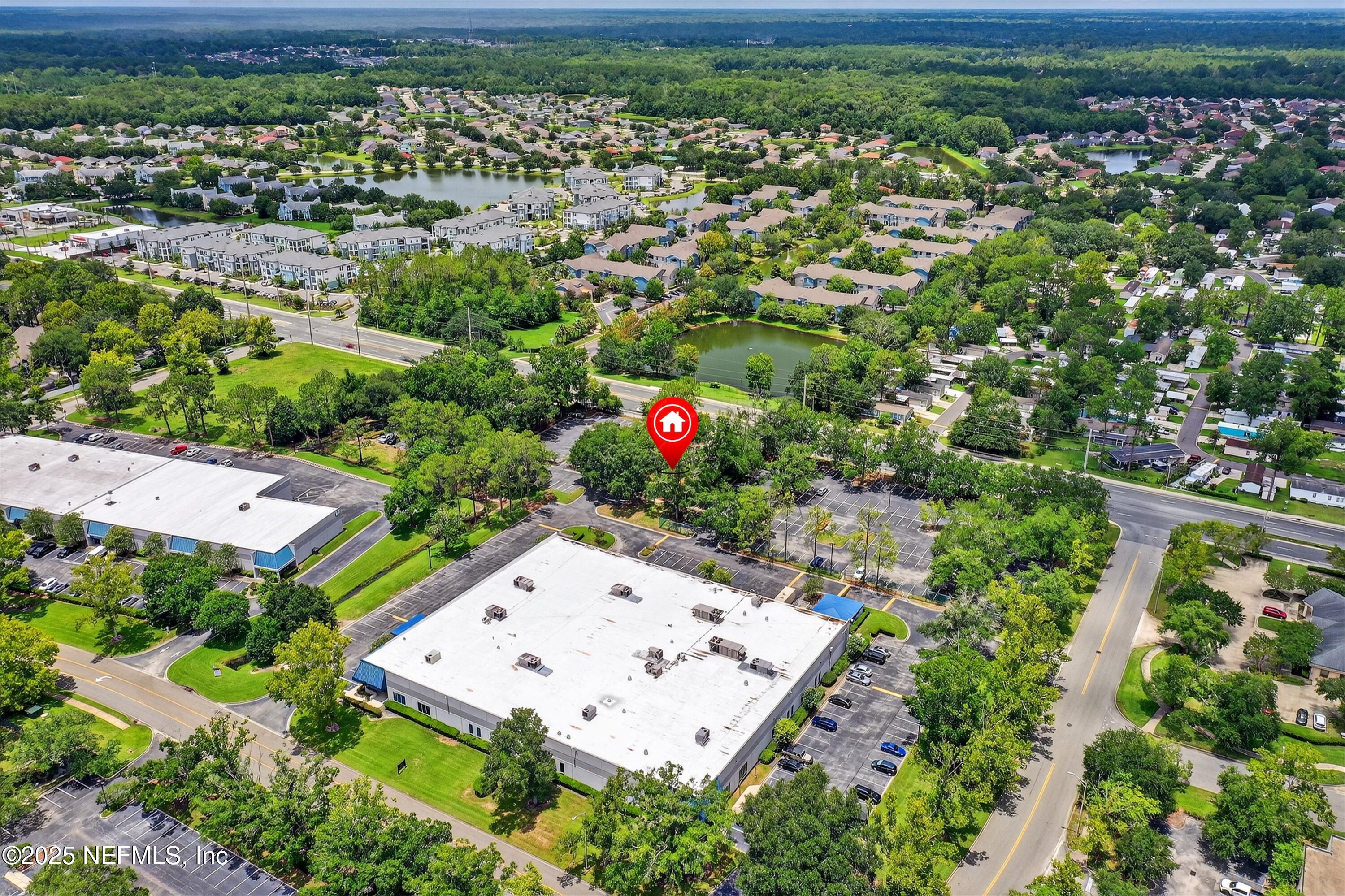6346 Collins Road Jacksonville, FL 32244 - Photo 12 of 17 an aerial view of a house with a yard