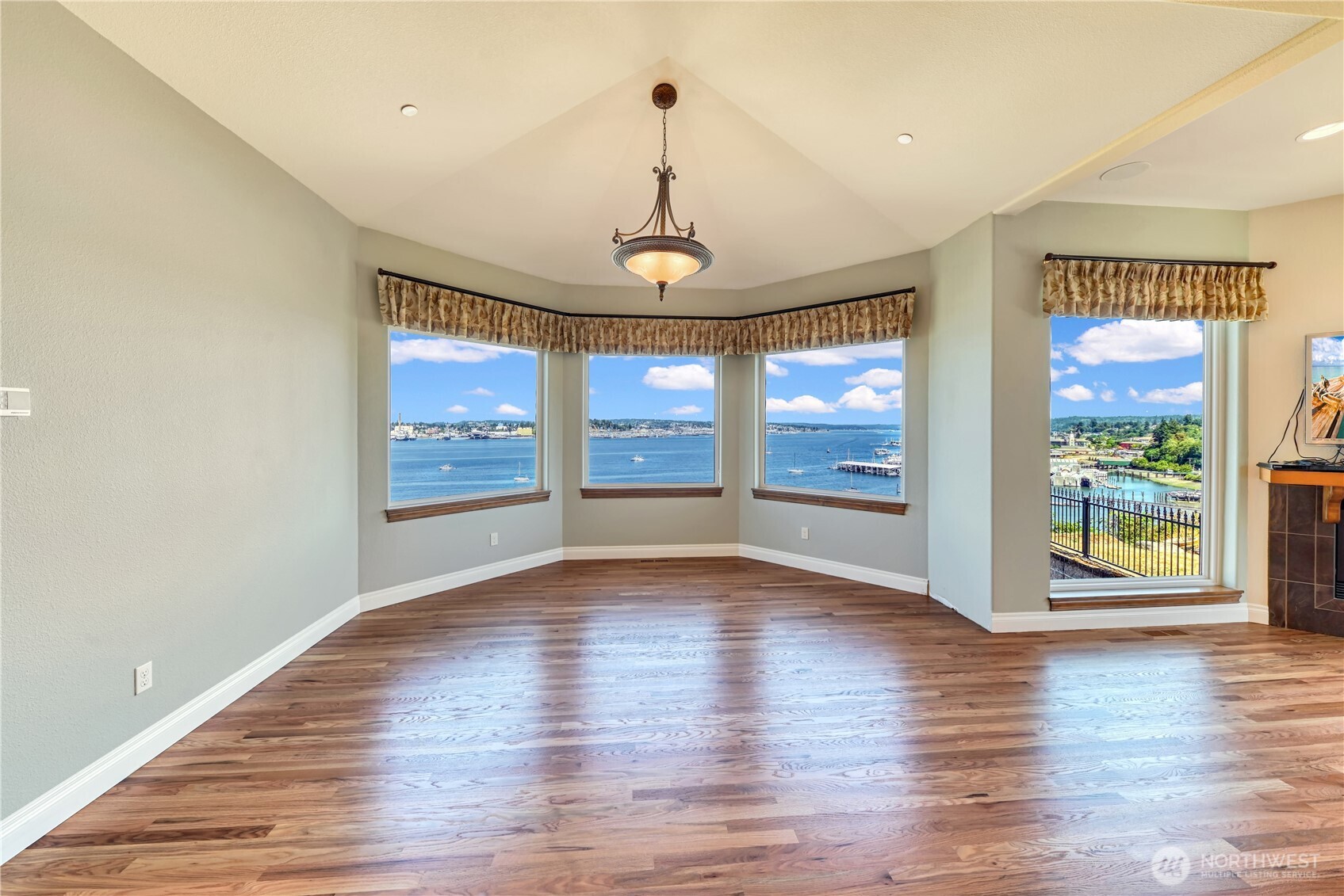 254 Caseco Lane Port Orchard, WA 98366 - Photo 13 of 28 a view of an empty room with wooden floor and a window
